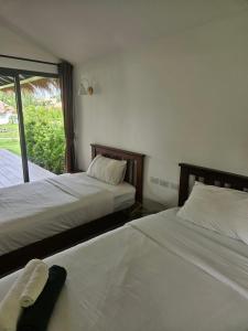 Postel nebo postele na pokoji v ubytování Sunrise Beach Resort