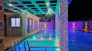 Bazén v ubytování Samriddha Beach Resort nebo v jeho okolí