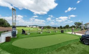 a golf course with a putting green with people on it at San Roque 5001 Golf&Relax in San Roque