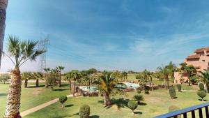 a view of a park with palm trees and a resort at Casa PedroRoca VA-Murcia Holiday Rentals Property in Torre-Pacheco
