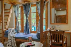 a room with a bed in a tree house at Pax Hotel Rock Villa Swimming Pool Available Dalhousie in Dalhousie
