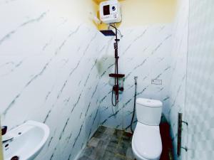 Koupelna v ubytování VIP CoLiving Syariah near Univ Muhammadiyah Purwokerto RedPartner