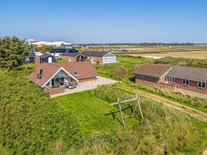 an aerial view of a house with a yard at Just 500 Meters From Both The Sea And The Town, This Lovely, Well-Maintained Holiday Home Is Situated in Ringkøbing