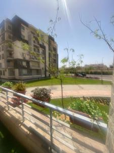 a view of a building from a window at شقه فندقيه لك بالكامل غرفتين في كمباوند راقي بالشيخ زايد in Sheikh Zayed +13 photos