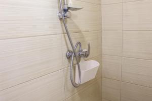 a shower in a bathroom with a shower head at Air&Day in Vecsés +37 photos
