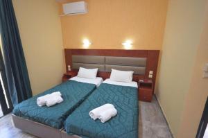 Posteľ alebo postele v izbe v ubytovaní Kerkyra Beach Hotel & Apartments