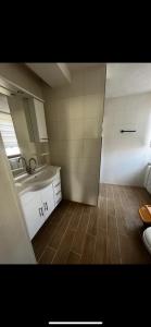 a small bathroom with a sink and a mirror at Pension in der schönen Rhön in Stadtlengsfeld +7 photos