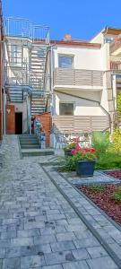 a house with a stone walkway in front of it at Apartment 3 in Altstadt in Angermünde in Angermünde