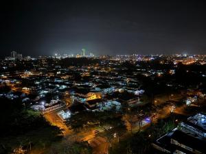 a view of a city at night with lights at A Tower Dream Home in Sibu