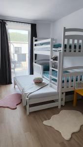 En eller flere senge i et værelse på Jump Rezidencia Bojnice