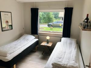 Postel nebo postele na pokoji v ubytování Skovly