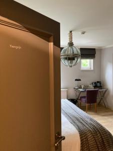 Ein Bett oder Betten in einem Zimmer der Unterkunft Villa Reynaert