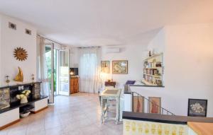 a living room with white walls and a staircase at Lovely Home In Recco With Wifi in Recco