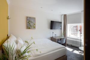 Postel nebo postele na pokoji v ubytování Hotel Kredell