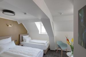Postel nebo postele na pokoji v ubytování Hotel Kredell