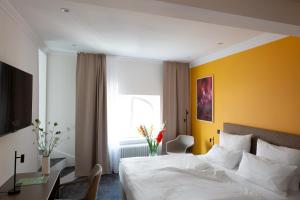 Postel nebo postele na pokoji v ubytování Hotel Kredell