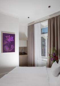 Postel nebo postele na pokoji v ubytování Hotel Kredell