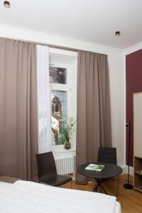 Postel nebo postele na pokoji v ubytování Hotel Kredell