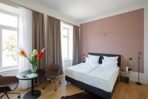 Postel nebo postele na pokoji v ubytování Hotel Kredell