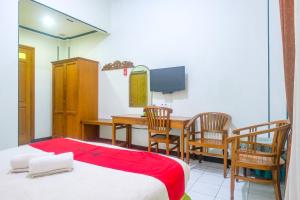 Voodi või voodid majutusasutuse RedDoorz near XT Square Yogyakarta toas