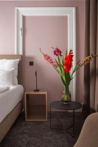 Postel nebo postele na pokoji v ubytování Hotel Kredell