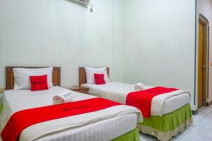 Voodi või voodid majutusasutuse RedDoorz near XT Square Yogyakarta toas