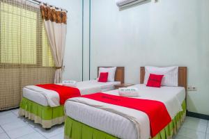 Voodi või voodid majutusasutuse RedDoorz near XT Square Yogyakarta toas