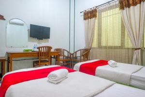 Voodi või voodid majutusasutuse RedDoorz near XT Square Yogyakarta toas