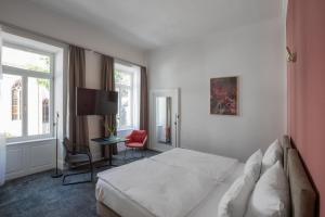 Postel nebo postele na pokoji v ubytování Hotel Kredell