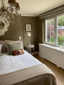 Ein Bett oder Betten in einem Zimmer der Unterkunft Villa Reynaert