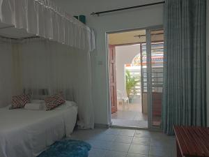 Ένα ή περισσότερα κρεβάτια σε δωμάτιο στο Kamsons villa