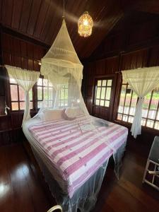 Voodi või voodid majutusasutuse Phuthipthara Resort toas