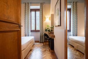 Postel nebo postele na pokoji v ubytování Guest House Morandi