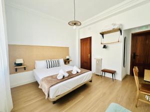 a bedroom with a bed with two towels on it at Autentic Boutique Moncloa in Madrid +70 photos