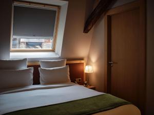 Postel nebo postele na pokoji v ubytování 5 Terres Hotel & Spa - MGallery Collection