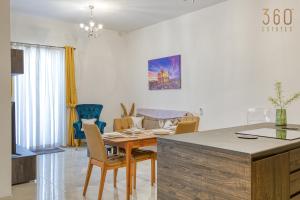 A seating area at Stylish 3BR home with large terrace in Mosta by 360 Estates