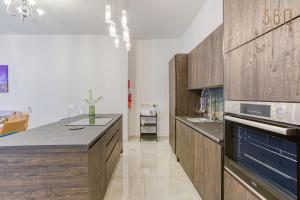 A kitchen or kitchenette at Stylish 3BR home with large terrace in Mosta by 360 Estates