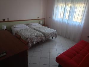 Postel nebo postele na pokoji v ubytování Park Hotel Paradiso