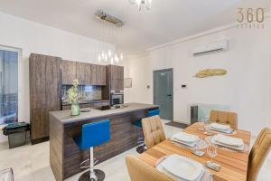 A kitchen or kitchenette at Stylish 3BR home with large terrace in Mosta by 360 Estates