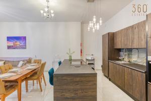 A kitchen or kitchenette at Stylish 3BR home with large terrace in Mosta by 360 Estates