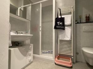 a bathroom with a shower and a sink and a toilet at Gaia Home by Holiday Home in Loano