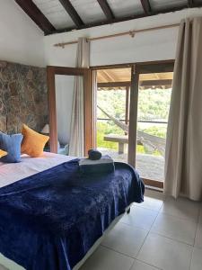 Postel nebo postele na pokoji v ubytování Fortress J Bequia