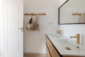a bathroom with a sink and a mirror at Villa With Privat Saltwater Pool in Benalmádena +17 photos