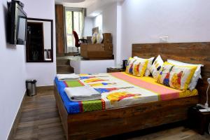 Postel nebo postele na pokoji v ubytování Tatvamasi Homestay + 43 fotografií