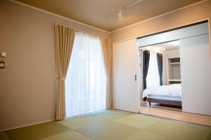 Postel nebo postele na pokoji v ubytování STAY in 小平
