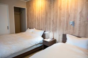 Postel nebo postele na pokoji v ubytování STAY in 小平