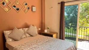 Postel nebo postele na pokoji v ubytování Arize You Homes Anjuna