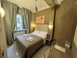 Postel nebo postele na pokoji v ubytování Hotel Parma