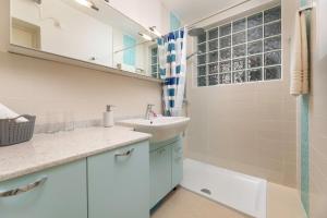 a bathroom with a sink and a shower at Apartman Fana in Njivice +12 photos