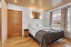 Ένα ή περισσότερα κρεβάτια σε δωμάτιο στο Charming villa with a hot tub, by the Golden Circle